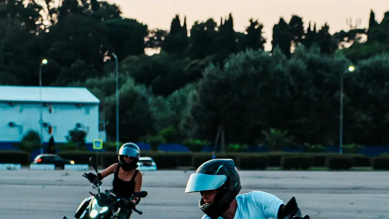 Riders practising turns around cones on a training ground